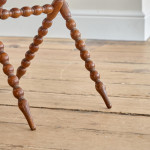 A Victorian walnut folding bobbin table