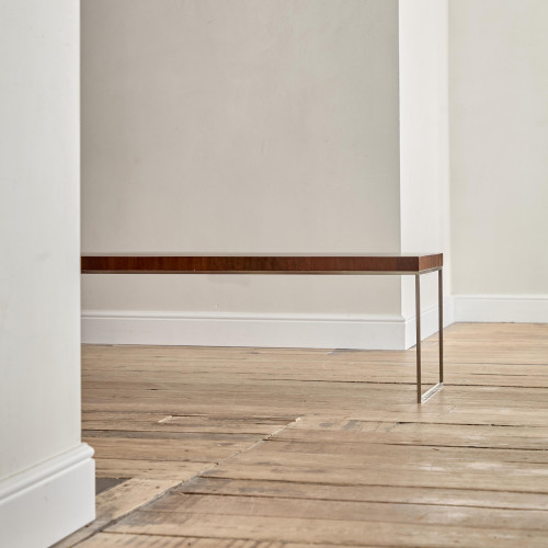 A rectangular steel and end-grain teak coffee table