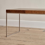 A rectangular steel and end-grain teak coffee table