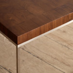 A rectangular steel and end-grain teak coffee table