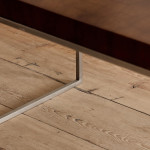 A rectangular steel and end-grain teak coffee table