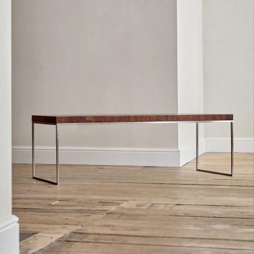 A rectangular steel and end-grain teak coffee table