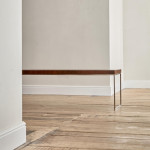 A rectangular steel and end-grain teak coffee table