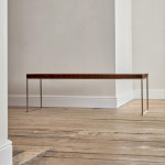 A rectangular steel and end-grain teak coffee table