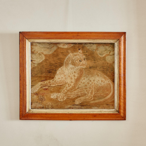 A large 19th century woolwork picture of a leopard