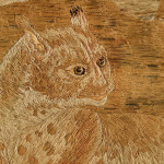 A large 19th century woolwork picture of a leopard