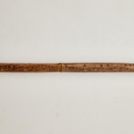 An incised bamboo cane depicting trade shipping at the Dejima Gate, Nagasaki
