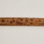 An incised bamboo cane depicting trade shipping at the Dejima Gate, Nagasaki
