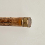 An incised bamboo cane depicting trade shipping at the Dejima Gate, Nagasaki