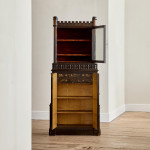 An unusual George IV Gothic revival Japanned cabinet