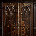 An unusual George IV Gothic revival Japanned cabinet