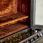 An unusual George IV Gothic revival Japanned cabinet