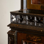 An unusual George IV Gothic revival Japanned cabinet