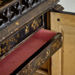 An unusual George IV Gothic revival Japanned cabinet