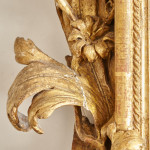 A fine and large carved and giltwood Baroque mirror in the manner of Filippo Passarini (1638 - 1698)
