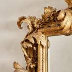 A fine and large carved and giltwood Baroque mirror in the manner of Filippo Passarini (1638 - 1698)