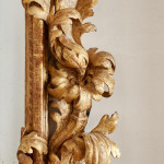 A fine and large carved and giltwood Baroque mirror in the manner of Filippo Passarini (1638 - 1698)