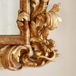 A fine and large carved and giltwood Baroque mirror in the manner of Filippo Passarini (1638 - 1698)