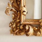A fine and large carved and giltwood Baroque mirror in the manner of Filippo Passarini (1638 - 1698)