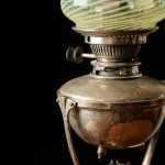 A model 394 silver-plated Arts & Crafts oil lamp on stand by W.A.S. Benson (1858 - 1924) with original vaseline glass shade by James Powell & Sons