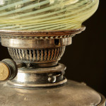A model 394 silver-plated Arts & Crafts oil lamp on stand by W.A.S. Benson (1858 - 1924) with original vaseline glass shade by James Powell & Sons