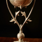 A model 394 silver-plated Arts & Crafts oil lamp on stand by W.A.S. Benson (1858 - 1924) with original vaseline glass shade by James Powell & Sons