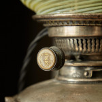 A model 394 silver-plated Arts & Crafts oil lamp on stand by W.A.S. Benson (1858 - 1924) with original vaseline glass shade by James Powell & Sons