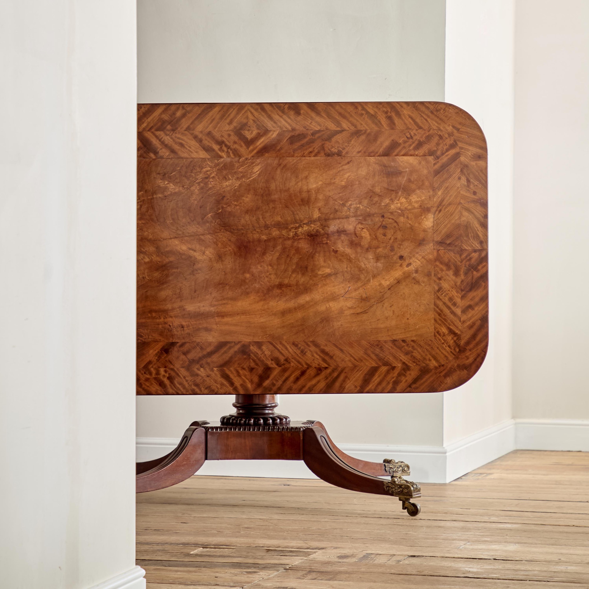 A Regency mahogany crossbanded rectangular snap top centre table