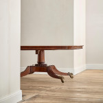 A Regency mahogany crossbanded rectangular snap top centre table