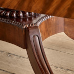 A Regency mahogany crossbanded rectangular snap top centre table