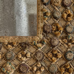 A Charles II embroidered wool and raised work framed mirror