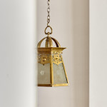 An Arts & Crafts brass hall lantern