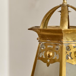 An Arts & Crafts brass hall lantern