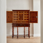 A fine William and Mary olivewood oyster veneered cabinet on stand