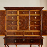 A fine William and Mary olivewood oyster veneered cabinet on stand