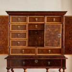 A fine William and Mary olivewood oyster veneered cabinet on stand