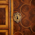 A fine William and Mary olivewood oyster veneered cabinet on stand