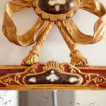 An 18th century carved parcel-gilt and red lacquered Venetian mirror