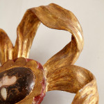 An 18th century carved parcel-gilt and red lacquered Venetian mirror