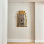 A George I carved giltwood mirror in the manner of James Moore