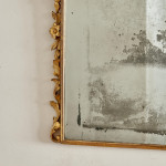 A George I carved giltwood mirror in the manner of James Moore