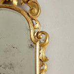 A George I carved giltwood mirror in the manner of James Moore