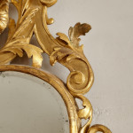 A George I carved giltwood mirror in the manner of James Moore