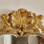 A George I carved giltwood mirror in the manner of James Moore