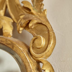 A George I carved giltwood mirror in the manner of James Moore