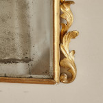 A George I carved giltwood mirror in the manner of James Moore