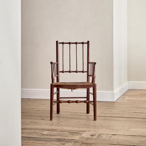 An Arts & Crafts armchair in the manner of Liberty & Co