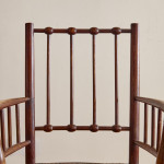 An Arts & Crafts armchair in the manner of Liberty & Co