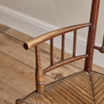 An Arts & Crafts armchair in the manner of Liberty & Co