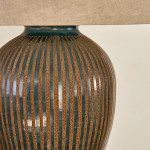 A green baluster vase by Roger Calero, converted to a lamp